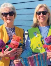  ?? ?? Diana Bamford of the Knysna Lions with Cheryl Britz of Knysna Community Police Forum, collecting teddies and beanies to be donated to traumatise­d children.