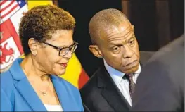 ?? Irfan Khan Los Angeles Times ?? L.A. MAYOR Karen Bass confers with Erroll Southers at a news conference last week. Bass appointed Southers to the Police Commission in February.
