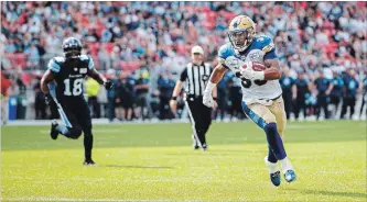  ?? MARK BLINCH THE CANADIAN PRESS ?? Andrew Harris ran for a career-high 161 yards and scored two TDs to lead the Bombers past the Argos, 38-20.