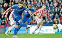  ??  ?? Chelsea's Frank Lampard scores a penalty against Stoke City during their English Premier League soccer match at the Britannia Stadium in Stoke-on-Trent, northern England. REUTERS