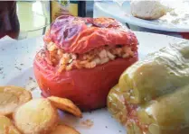  ??  ?? STUFFED TOMATOES on a platter, a speciality in Santorini.