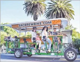  ?? STEVE MACNAULL PHOTO ?? Travel writer Steve MacNaull’s group arrived at Sacramento’s fancy Lucca Restaurant & Bar, a favourite of former California Governor Arnold Schwarzene­gger, via Sac Brew Bike’s party bike.