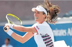  ??  ?? Johanna Konta returns a shot against Shuai Zhang.