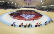  ?? AFP ?? Riders compete in the women’s omnium eliminatio­n track cycling event in Jakarta yesterday.
