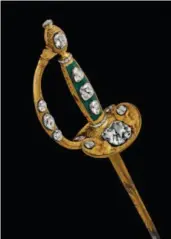  ??  ?? Consular Sword, also known as Napoleon I’s Coronation Sword, 1804, acquired by the Louvre, France. A crown decorated with egret feathers, 1914, acquired by Chaumet.