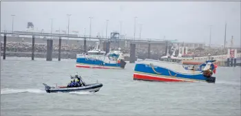  ?? — AFP photo ?? French fishing boats block the entrance to the port of Calais as fishermen began a day of action to disrupt cross-Channel traffic in protest at the post-Brexit fishing rights granted by Britain, blocking ferries seeking to access the northern port of Calais.