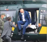  ?? (AFP) ?? European Council President Charles Michel (centre) steps out of a helicopter in Medininkai, Lithuania, on Tuesday.