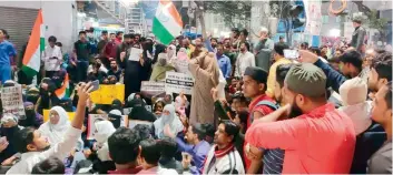  ??  ?? Around 200 women staged a flash protest against the CAA near Meeraj Hotel on Friday.