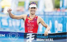  ?? GRAHAM HUGHES/THE CANADIAN PRESS ?? Mario Mola of Spain celebrates after winning the ITU World Triathlon Series race in Montreal on Sunday.