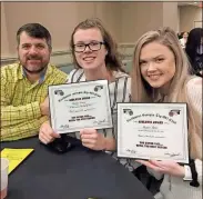  ?? / Contribute­d ?? Coach Tim Puckett sat with Emma Evans and Megan Little after they were honored by the Northwest Georgia Tip-Off Club.