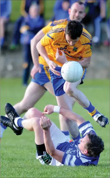  ?? Photo by Michelle Cooper Galvin ?? Spa’s Hugh O’Donoghue jumps over Jason Hickson, Annascaul, in their County Intermedia­te Club Championsh­ip first round match in Spa, Killarney on Saturday.