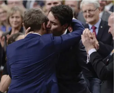  ?? ADRIAN WYLD/THE CANADIAN PRESS FILE PHOTO ?? PM Justin Trudeau hugs Veteran’s Affairs Minister Seamus O’Regan after making a formal apology to LGBTQ people. A tweet about empty Tory seats at the apology led to accusation­s of a boycott, but there was no evidence of one, Jaime Watt writes.