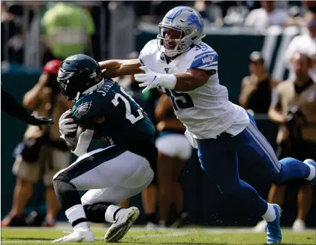  ?? MATT ROURKE — THE ASSOCIATED PRESS ?? The Eagles’ Miles Sanders, left, getting tackled by Detroit’s Miles Killebrew, continues to be dogged by fumbling problems in his rookie season.