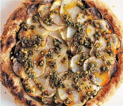  ?? ANDREW SCRIVANI NEW YORK TIMES ?? Until better times, stick to hugging those in your bubble, but make spinach and chermoula pie for those you’re able to share food with or deliver food to.