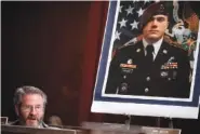  ?? AP PHOTO/ANDREW HARNIK ?? An image of Army Staff Sgt. Ryan C. Knauss, one of the members of the military killed during the withdrawal of Afghanista­n, is displayed Wednesday behind Rep. Tim Burchett, R-Tenn., as he speaks during a hearing on Capitol Hill in Washington.