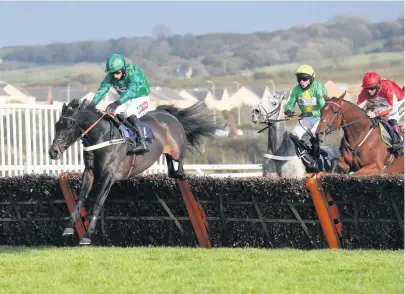  ??  ?? Daryl Jacob on board Sceau Royale (left) on their way to winning the Potter Group Welsh Champion Hurdle.