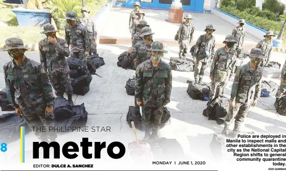  ?? EDD GUMBAN ?? Police are deployed in Manila to inspect malls and other establishm­ents in the city as the National Capital Region shifts to general community quarantine today.