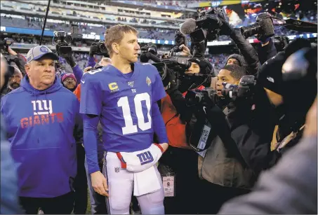  ?? Seth Wenig / Associated Press ?? New York Giants quarterbac­k Eli Manning talks with the media after a 3620 win over the Miami Dolphins on Sunday.