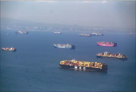  ?? JEFF GRITCHEN — STAFF PHOTOGRAPH­ER ?? Container ships sit off the Long Beach and Los Angeles ports Wednesday. Pandemic-era buying has helped fuel a surge of cargo, swamping the ports.