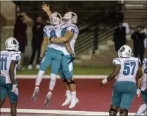  ?? VASHA HUNT - THE ASSOCIATED PRESS ?? Coastal Carolina wide receiver Jaivon Heiligh ( 6) and teammate Will Mcdonald ( 66) celebrate Heiligh’s touchdown against Troy during the second half of an NCAA college football game, Saturday, Dec. 12, 2020, in Troy, Ala.