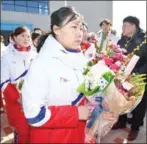  ?? AFP ?? Members of the North Korean women’s ice hockey team arrive at the South’s national training centre on Thursday.