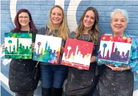  ?? Submitted photo ?? ■ Participan­ts show off their renditions of the Dallas skyline at Body of Art Texarkana. The business, along with ColorHype TXK, is hosting an art party fundraiser called Inks and Skylines on Tuesday, July 28 to benefit Harvest Texarkana’s backpack program.