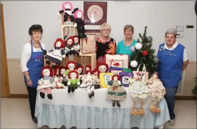  ?? The Sentinel-Record/Richard Rasmussen ?? SEWN TREASURES: Bobbie Watts, second from left, has done crafts for years. She creates a variety of sewn items. Her sister, Jean Lucas, works with her. They make Raggedy Ann dolls, ornaments, children’s purses and tote bags. Hostesses with them are...