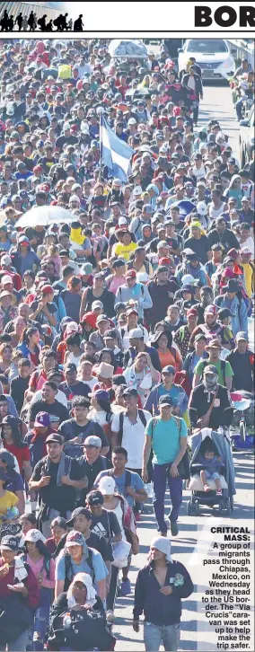  ?? ?? CRITICAL MASS: A group of migrants pass through Chiapas, Mexico, on Wednesday as they head to the US border. The “Via Crucis”caravan was set up to help make the trip safer.