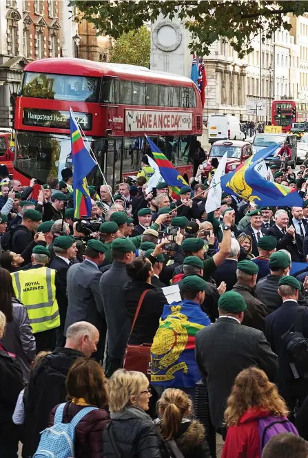  ??  ?? March of the green beret’: Royal Marines past and present gather at Downing Street to deliver their letter in support of Sgt Blackman