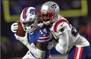  ?? ADRIAN KRAUS / AP ?? Buffalo Bills wide receiver Stefon Diggs (14) runs the ball against New England Patriots cornerback J.C. Jackson Jan. 15 in Orchard Park, N.Y.