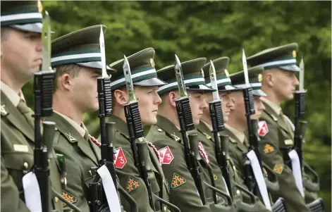  ??  ?? The Military Honour Guard stand to attention at the ceremonies in the JFK Arboretum.