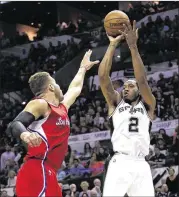  ?? CHRIS COVATTA / GETTY IMAGES ?? The Spurs’ Kawhi Leonard (shooting over Blake Griffin of the Clippers in last season’s playoffs) is driven to keep improving as a player.