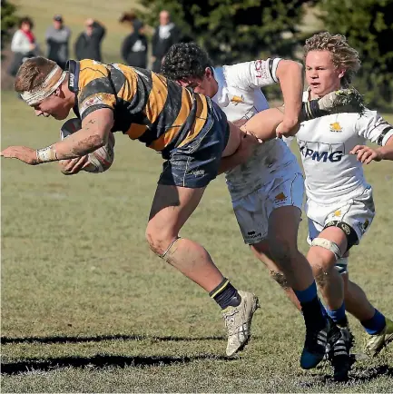  ?? JOHN BISSET/FAIRFAX NZ ?? Marlboroug­h’s Taine Cragg-Love gets dropped by TBHS’s Thomas Mulligan in their 18-12 defeat against Timaru Boys’ High.