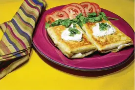  ?? LINDA GASSENHEIM­ER/TNS ?? You can use any type of cooked meat for this chimichang­a recipe.