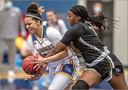  ?? NICK ELLIS / FOR THE CALIFORNIA­N ?? CSUB’s Jayden Eggleston, left, fights Long Beach State’s Jasmine Hardy for the ball during the first half of Friday night’s game at the Icardo Center.