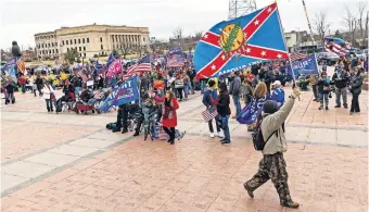  ?? [CHRIS LANDSBERGE­R/ THE OKLAHOMAN] ?? Trump supporters gather for a rally Wednesday at the Oklahoma State Capitol. The protest remained peaceful.