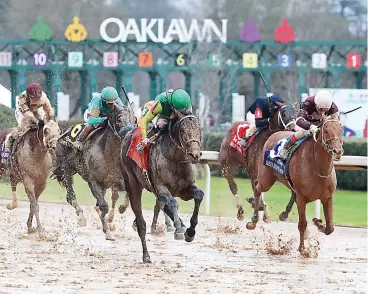  ?? Submitted photo ?? Confidence Game (7) battles with Red Route One (3) in the Grade 2 $1 million Rebel Stakes Saturday at Oaklawn. Photo courtesy of Coady Photograph­y.
