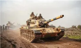  ?? Associated Press ?? Turkish army tanks enter Afrin, an enclave in northern Syria controlled by U.S.allied Kurdish fighters on Monday. Turkey rejected American calls for restraint.