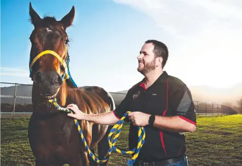  ?? Picture: BRENDAN RADKE ?? SENTIMENTA­L RUN: Cairns horse trainer Peter Rowe fancies the chances of Divine Service in the Cairns Newmarket.