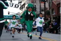  ?? KARL MONDON — BAY AREA NEWS GROUP ?? Patrick McCruskey races youngsters at the San Jose Shamrock Run Leprechaun Kids Race in 2019.