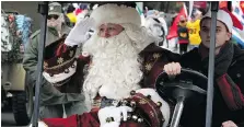  ?? - STAR FILES ?? Santa salutes members of Southern Ontario Military Muster during the Winter Fest parade in downtown Windsor recently. Left: Handel’s Messiah is a tradition with the Windsor Symphony Orchestra.