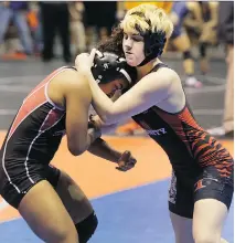  ?? MELISSA PHILLIP/HOUSTON CHRONICLE VIA THE ASSOCIATED PRESS ?? Mack Beggs, right, a transgende­r wrestler, competes in a girls’ quarterfin­al last month during the state wrestling tournament in Cypress, Texas.
