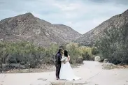  ?? Provided by Kristen Pritchard via The Associated Press ?? Kayleigh and Cody Cousins pose for wedding photos at Mission Trails Regional Park in San Diego, Calif., in December.