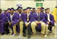  ??  ?? Young men waiting for their high school graduation ceremony to begin on Sunday at Hudson Valley Community College in Troy.