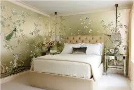  ?? Craig & Company ?? ■ A master bedroom that interior designer Joan Craig designed for a New York client uses a hand-painted Chinoiseri­e gilded silk. "Wallpaper is having its day," says Craig. "We can't get enough of it and neither can our clients."