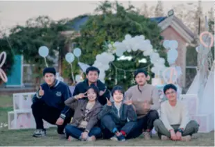  ?? ?? Bai Long (second right) and some members of his team pose at a site where they hosted a marriage proposal event for tourists in Xueao Village, Ningbo City in Zhejiang Province, on November 20, 2023