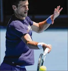  ?? MARK BAKER/AP ?? Novak Djokovic practices Wednesday ahead of the Australian Open in Melbourne. He still faces the prospect of deportatio­n because his exemption from COVID-19 vaccinatio­n rules has been questioned.