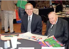  ?? Doug Walker / Rome News-Tribune ?? U.S. Magistrate Judge Walter E. Johnson (left) and U.S. District Court Judge Harold L. Murphy visit prior to Friday’s luncheon at the Rome Civic Center.
