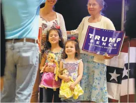  ?? GERALD HERBERT/ASSOCIATED PRESS ?? Supporters of Donald Trump pose for photos after the Republican presidenti­al candidate spoke at a campaign rally in Manchester, New Hampshire.