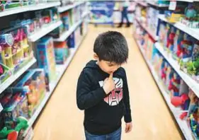  ?? New York Times ?? ■ Liam Dosse, 6, searches for toys during his weekly trip to Toys “R” Us in Maplewood, Minnesota.